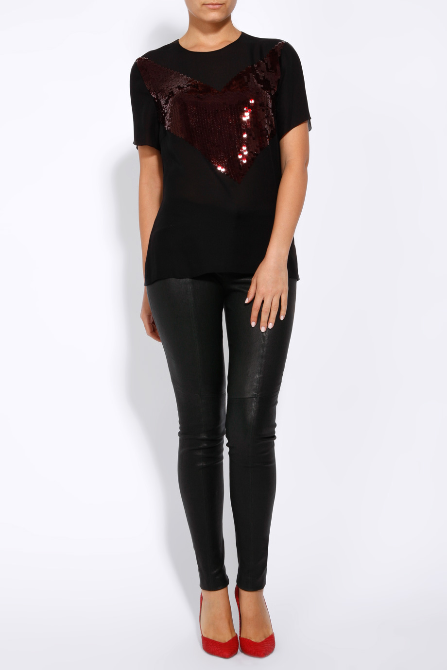 model wearing Jason Wu black sequin embelished tee with black skinny leather pants and red pumps