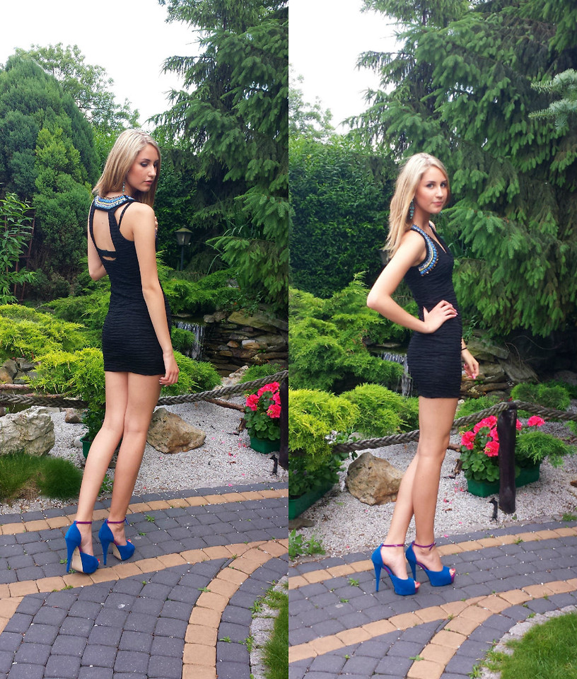 Marta B from Sweden models a little black dress with blue high heels