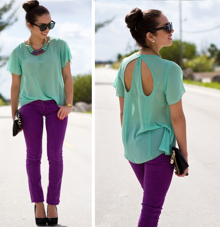 blogger Daniela Ramirez wears a mint green top with purple jeans