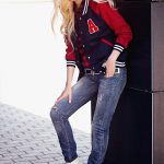 Fashion blogger and model oksana orehhova navy red white baseball varsity jacket skinny blue jeans red checkered skirt white canvas sneakers