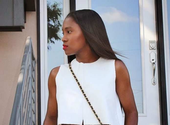 Ranti Onayemi Chanel classic flap bag gold black skirt white top outfit