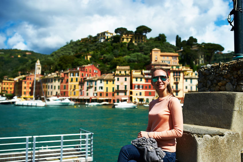 woman in peach sweater and jeans Portofino Italy
