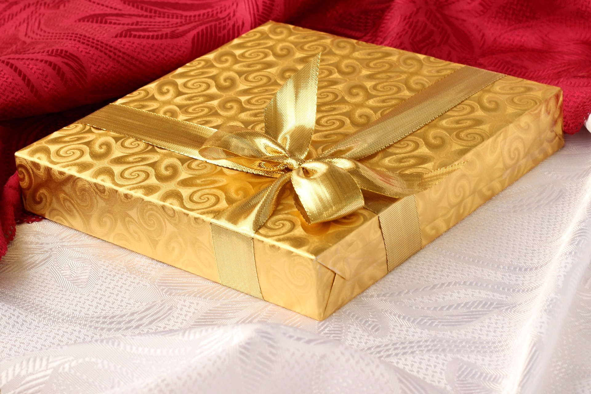happy holidays 2015 picture of gift wrapped in gold wrapping paper