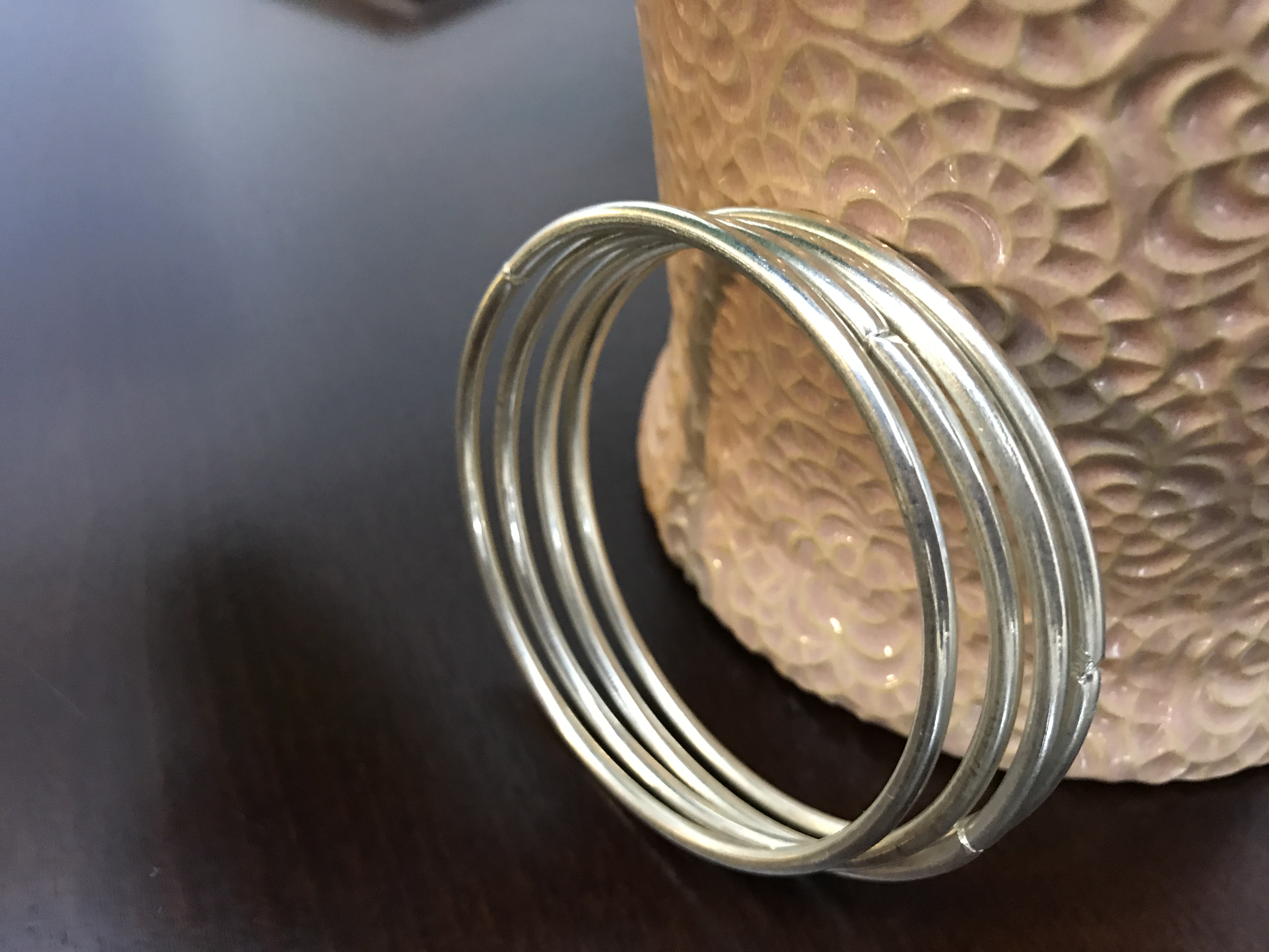 Set of 4 silver tone bangle bracelets used