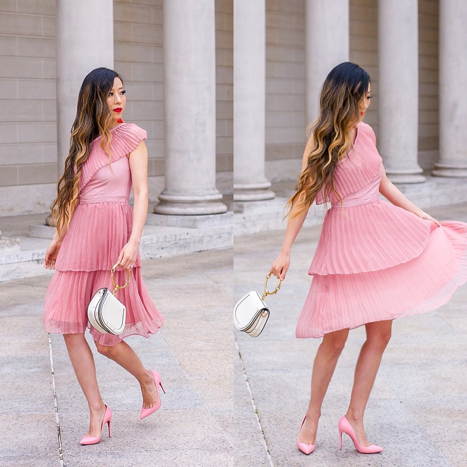 Sasa Zoe from the blog shallwesasa wearing a pink pleated dress with pink pumps