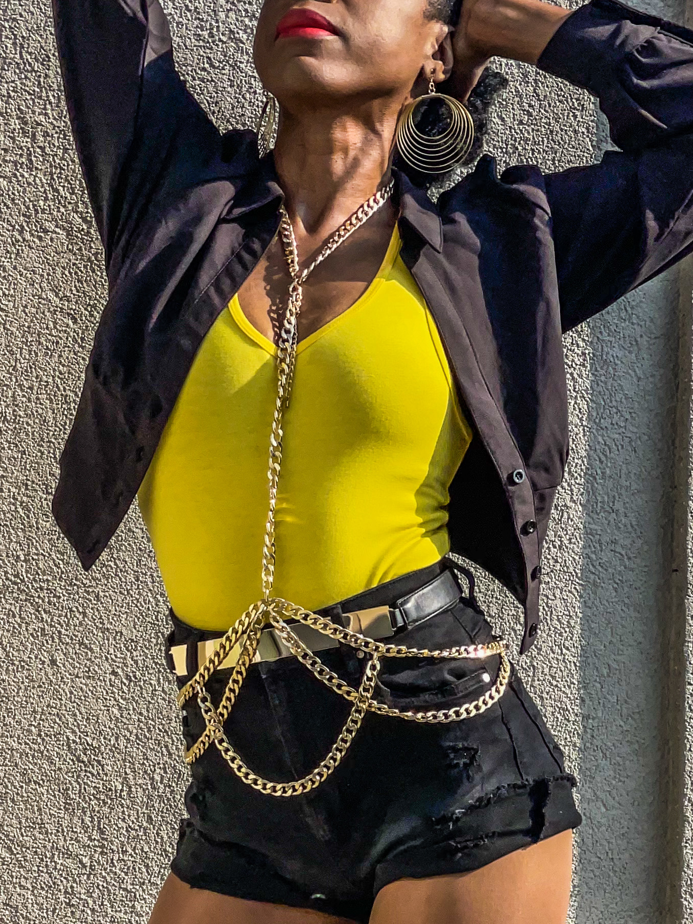 Fashionnova gold body chain wear over clothes looks yellow tank top black denim shorts