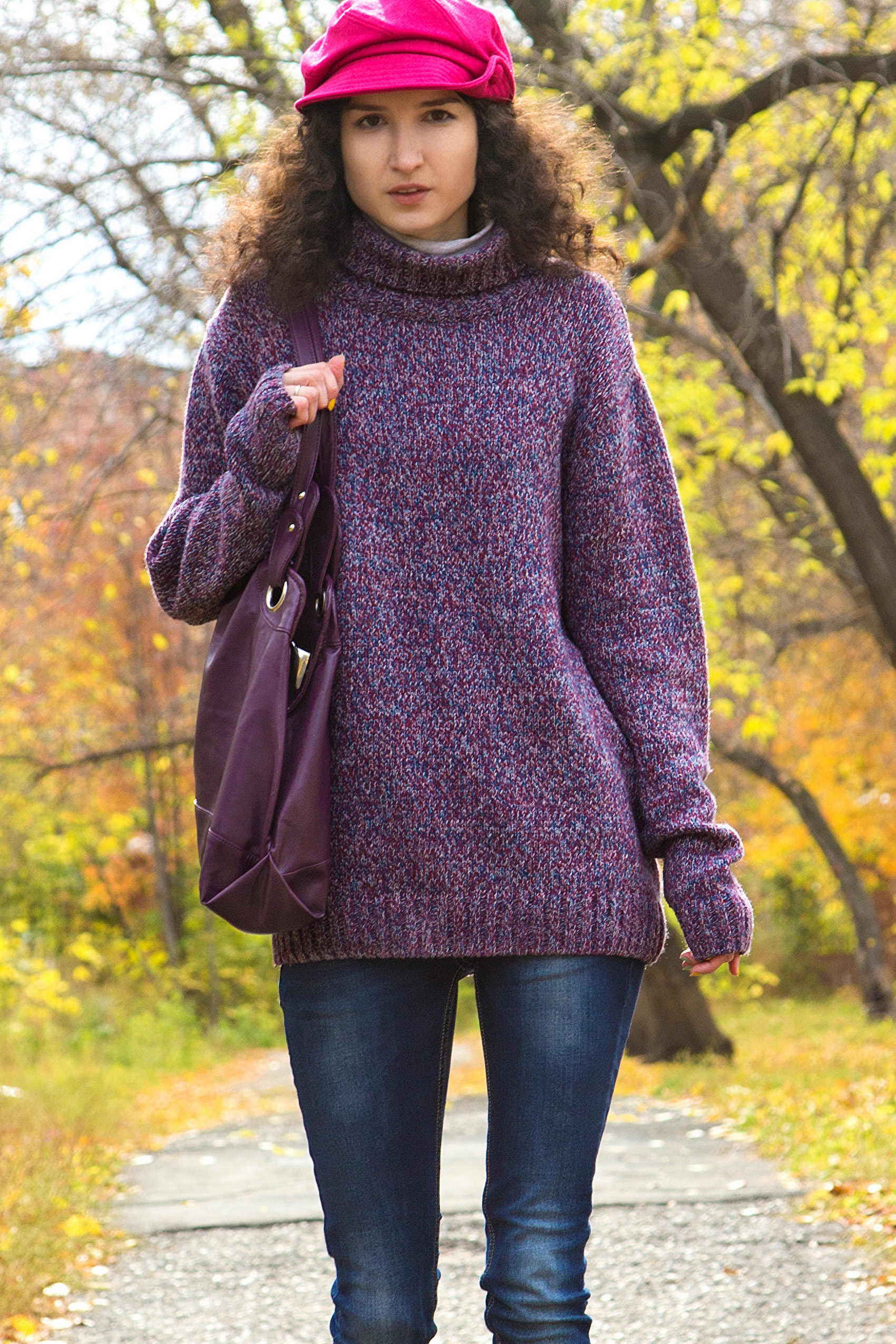 model wearing purple sweater with blue jeans